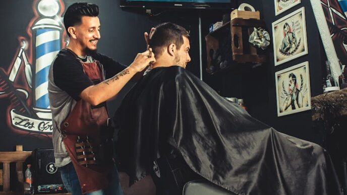 A barber skillfully cutting a man's hair in a trendy, well-decorated barbershop.