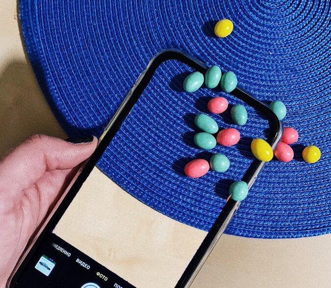 black samsung android smartphone with yellow and red beads