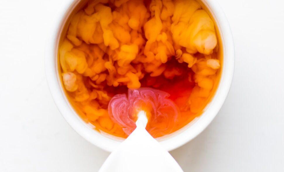 white ceramic bowl with yellow and red food