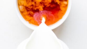 white ceramic bowl with yellow and red food