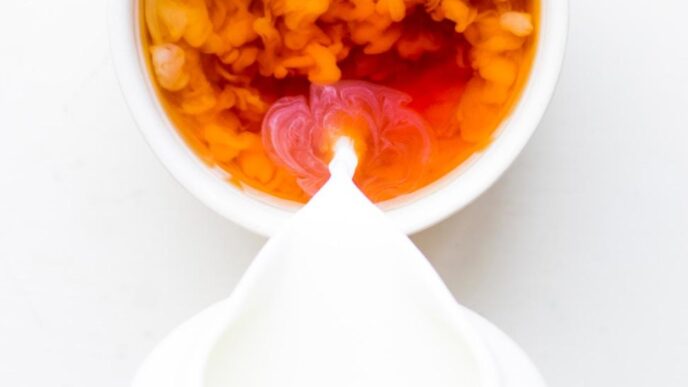 white ceramic bowl with yellow and red food