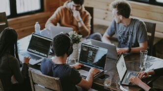 group of people using laptop computer