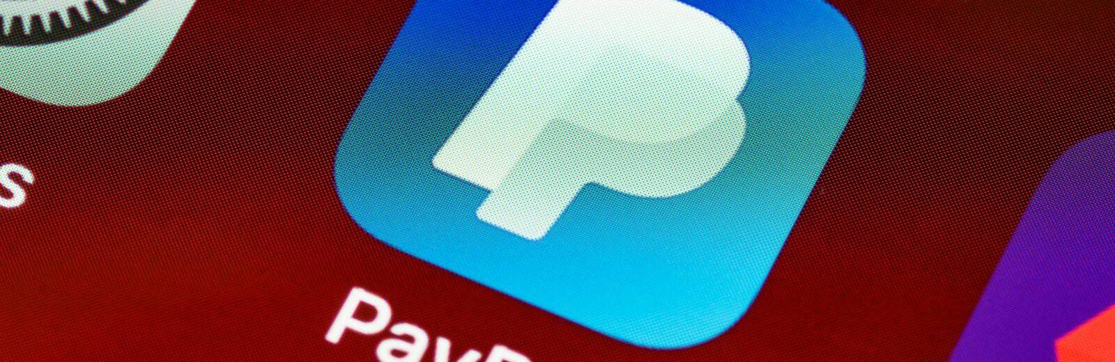 Detailed view of PayPal app icon on a smartphone screen highlighting mobile payment technology.