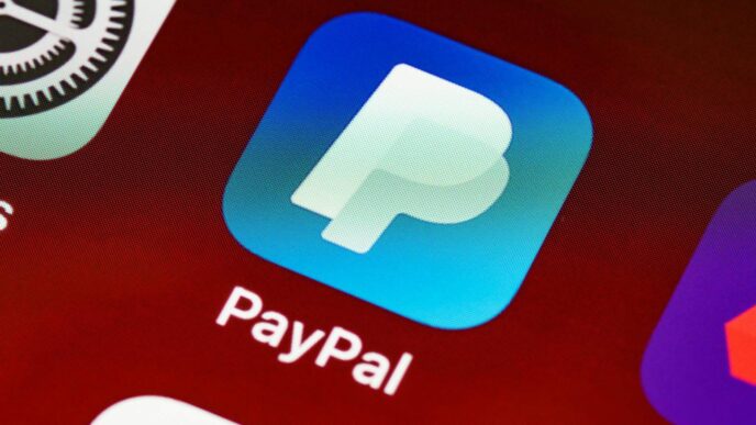 Detailed view of PayPal app icon on a smartphone screen highlighting mobile payment technology.