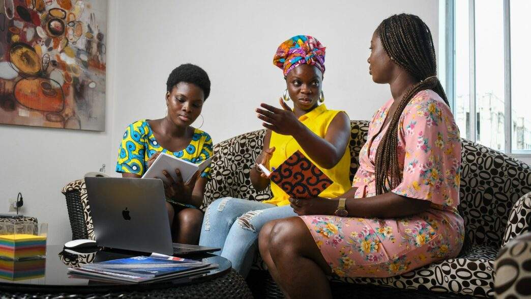 ABC-Dada Fellowship Program Empowers African Women in Bitcoin 1 a group of people sitting on a couch looking at a laptop