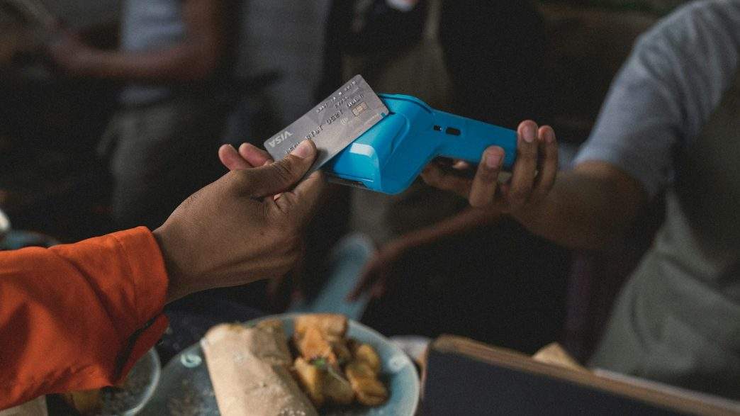 If People Would Know The True Cost Of Credit Cards, There Would Be A Revolution Before Tomorrow 1 a person holding a blue object in their hand