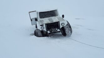 Stop Billing, Start Streaming: Austin Mitchell’s Case Against Net-30 Invoices 3 White 4x4 truck traversing snowy landscape in Karelia, Russia, showcasing adventure travel.