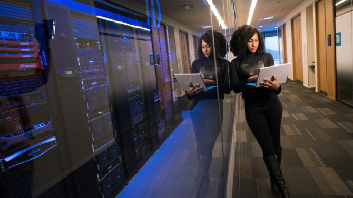 woman in black top using Surface laptop