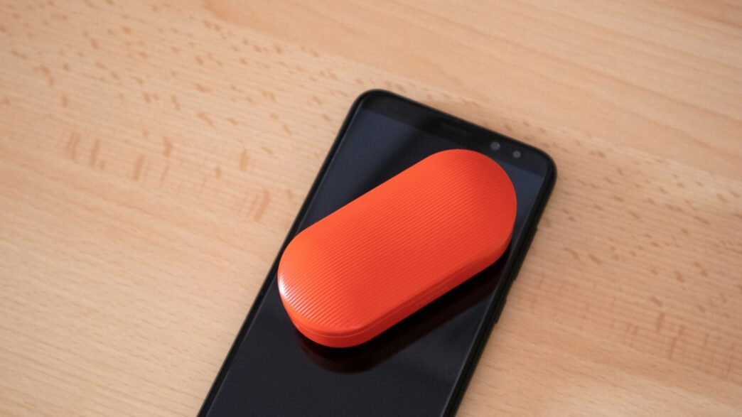 oval black case on black smartphone