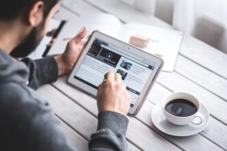 Payment innovation and the next generation of affiliate models 10 man, reading, touchscreen, coffee cup, blog, digital, tablet, working, screen, touching, touch, samsung, stylus, pen, technology, device, coffee, cup