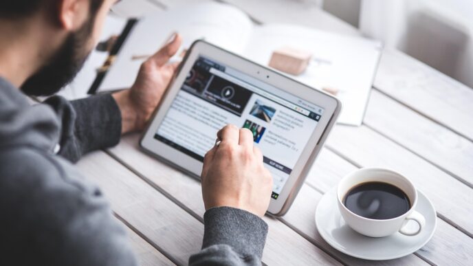 Payment innovation and the next generation of affiliate models 22 man, reading, touchscreen, coffee cup, blog, digital, tablet, working, screen, touching, touch, samsung, stylus, pen, technology, device, coffee, cup