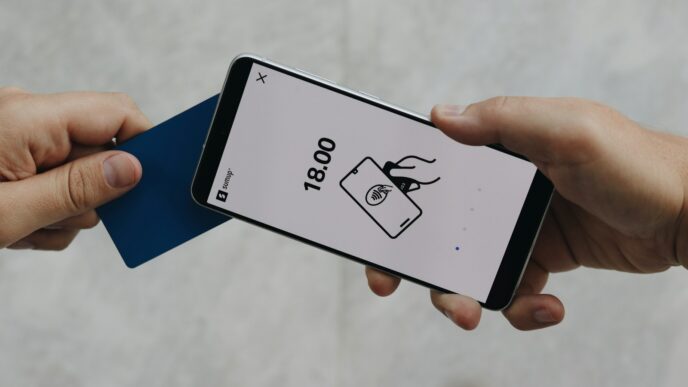 RiskPay launches affiliate platform with lifetime revenue share 22 A person holding a cell phone in their hand