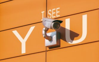 a security camera mounted to the side of a building