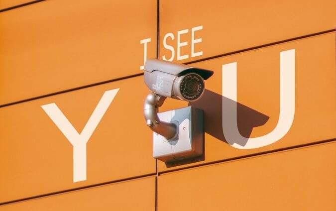 a security camera mounted to the side of a building