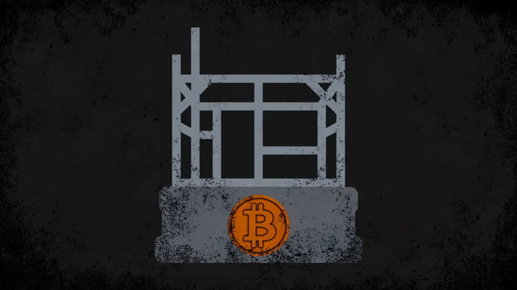 Unfinished house frame on a stone foundation with a Bitcoin coin, symbolising Bitcoin as sound base money still missing its credit layer.